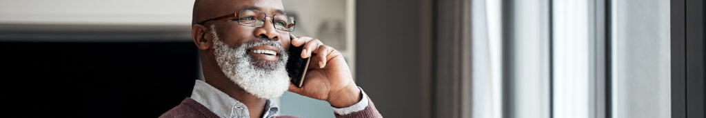 Man on phone calling to have a water filtration system installed in his Highland, CA home