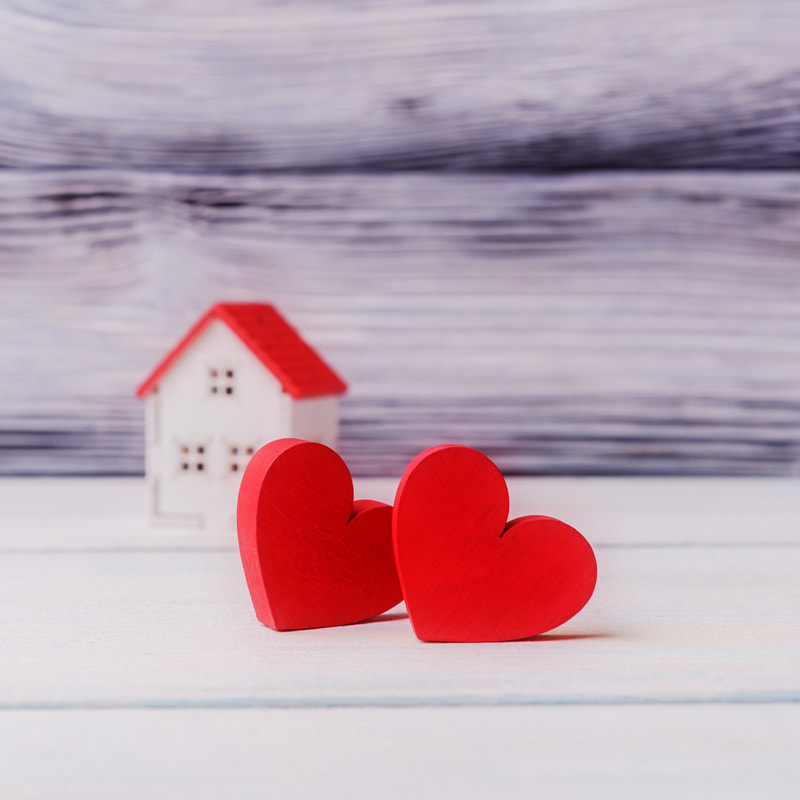 Hearts in front of a house