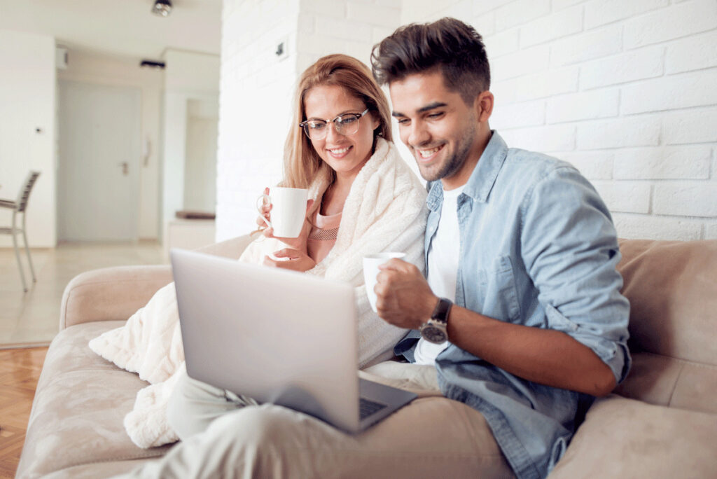 Couple getting info on laptop